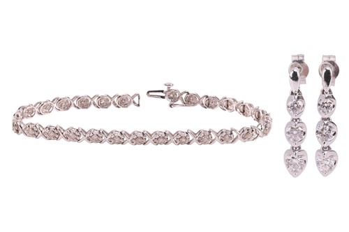 Lot 124 - A pair of three-stone diamond drop pendant...