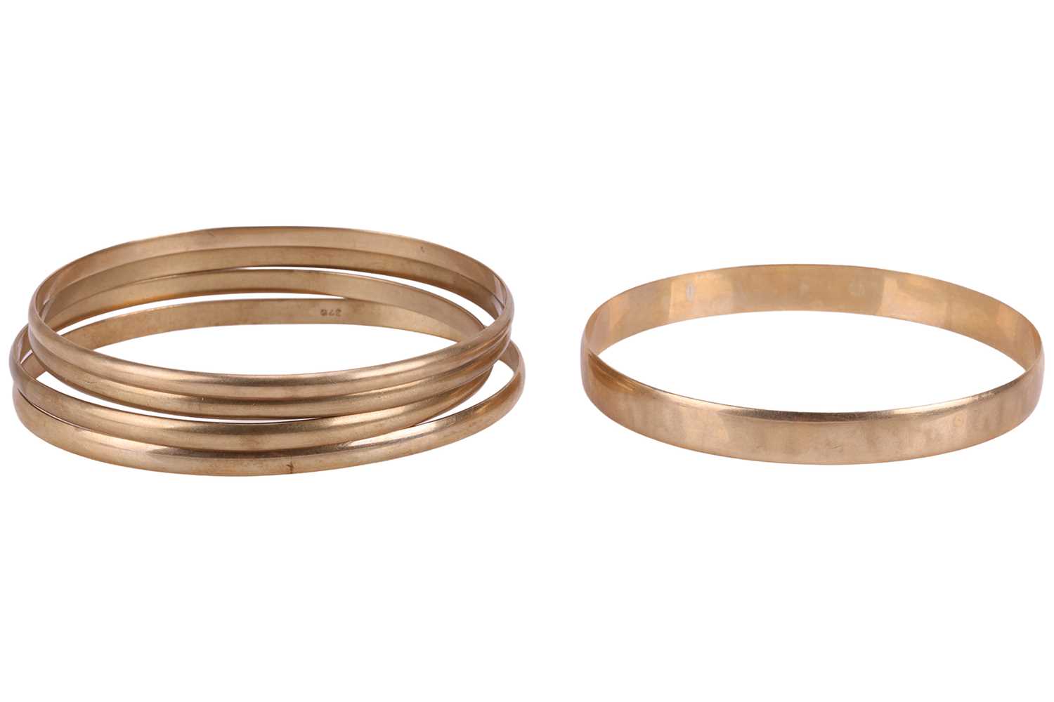 Lot 111 - A group of five closed bangles, all plain in...