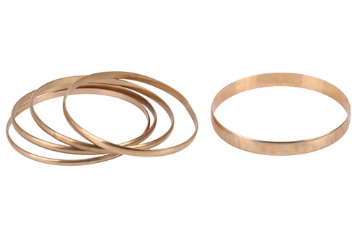 Lot 111 - A group of five closed bangles, all plain in...