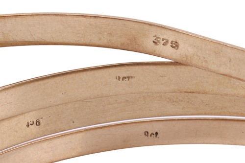 Lot 111 - A group of five closed bangles, all plain in...