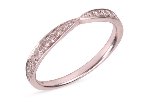 Lot 173 - Tiffany & Co. - A diamond-set wedding band in...