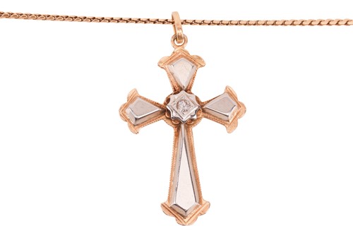 Lot 108 - A cross pendant on chain, the two-toned cross...