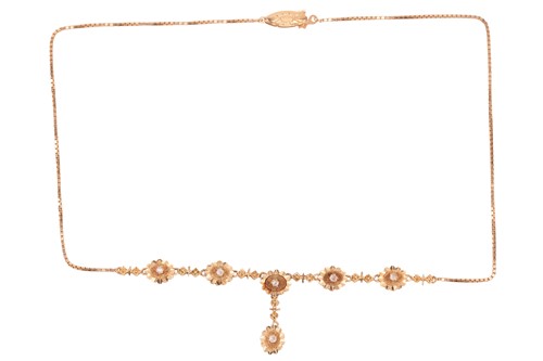 Lot 84 - A necklace of floral design, featuring a row...