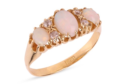 Lot 36 - An opal and diamond dress ring, comprising...