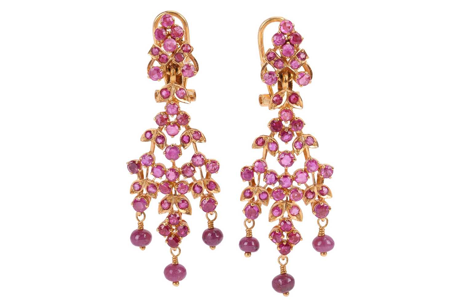 Lot 107 - A pair of ruby-set drop earrings of foliate...