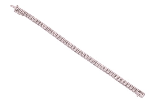 Lot 178 - A diamond line bracelet, featuring forty-eight...