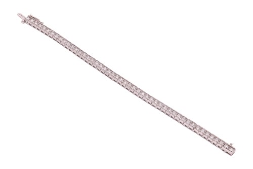 Lot 178 - A diamond line bracelet, featuring forty-eight...