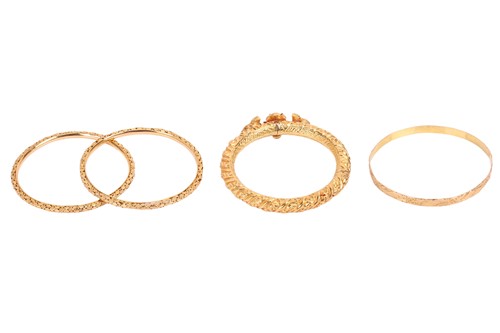 Lot 109 - A group of four bangles, to include; Two...