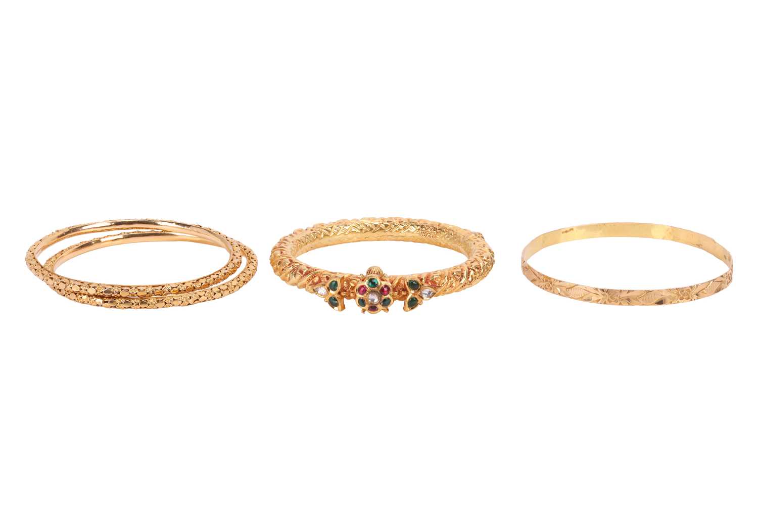 Lot 109 - A group of four bangles, to include; Two...