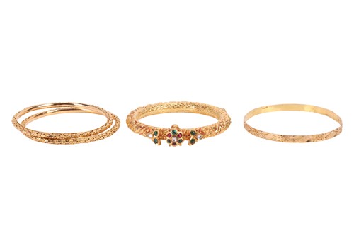 Lot 109 - A group of four bangles, to include; Two...