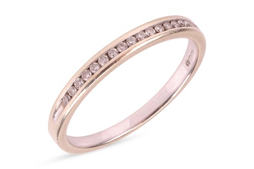 Lot 99 - A diamond half-eternity ring in 9ct white gold,...