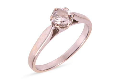 Lot 126 - A diamond solitaire ring, featuring a central...