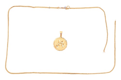 Lot 26 - An arabic script pendant on chain, featuring a...