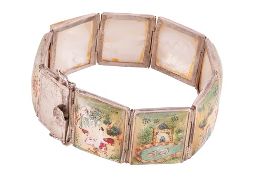 Lot 22 - A Persian ‘story’ bracelet, comprising eight...