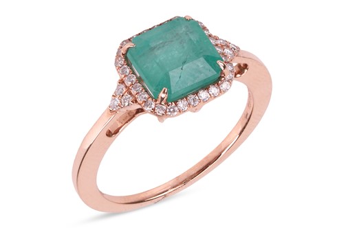 Lot 121 - An emerald and diamond-set ring, featuring a...