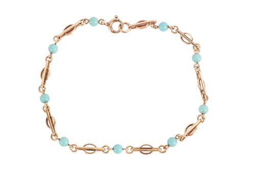 Lot 75 - A turquoise bead link bracelet in 9ct gold,...