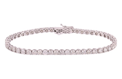 Lot A diamond line bracelet, comprising fifty-one...