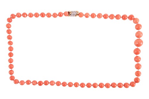 Lot 85 - A coral bead necklace with diamond-set clasp,...