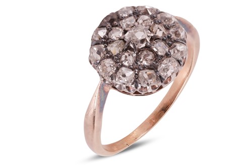 Lot 4 - An old-cut diamond cluster ring, featuring a...