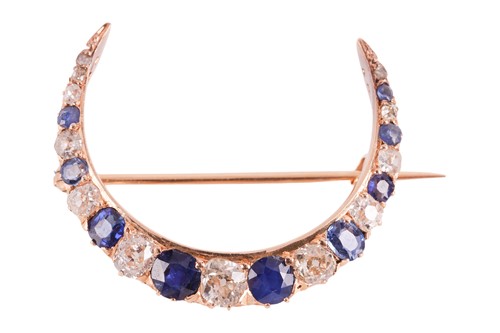 Lot A diamond and sapphire crescent brooch,...