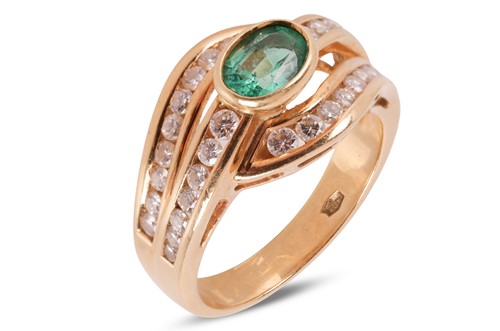 Lot 119 - An emerald and diamond dress ring, featuring a...