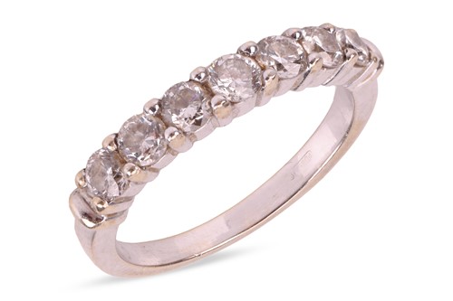 Lot 101 - A diamond half-eternity ring, featuring seven...
