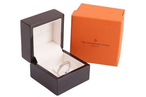 Lot 162 - A diamond half-eternity ring, featuring seven...