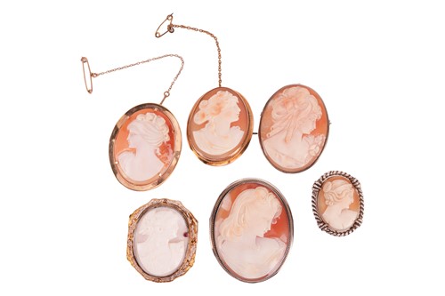 Lot 56 - A collection of six cameo brooches; to include...