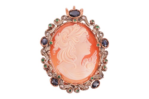 Lot 42 - A cameo with a sapphire and emerald surround,...