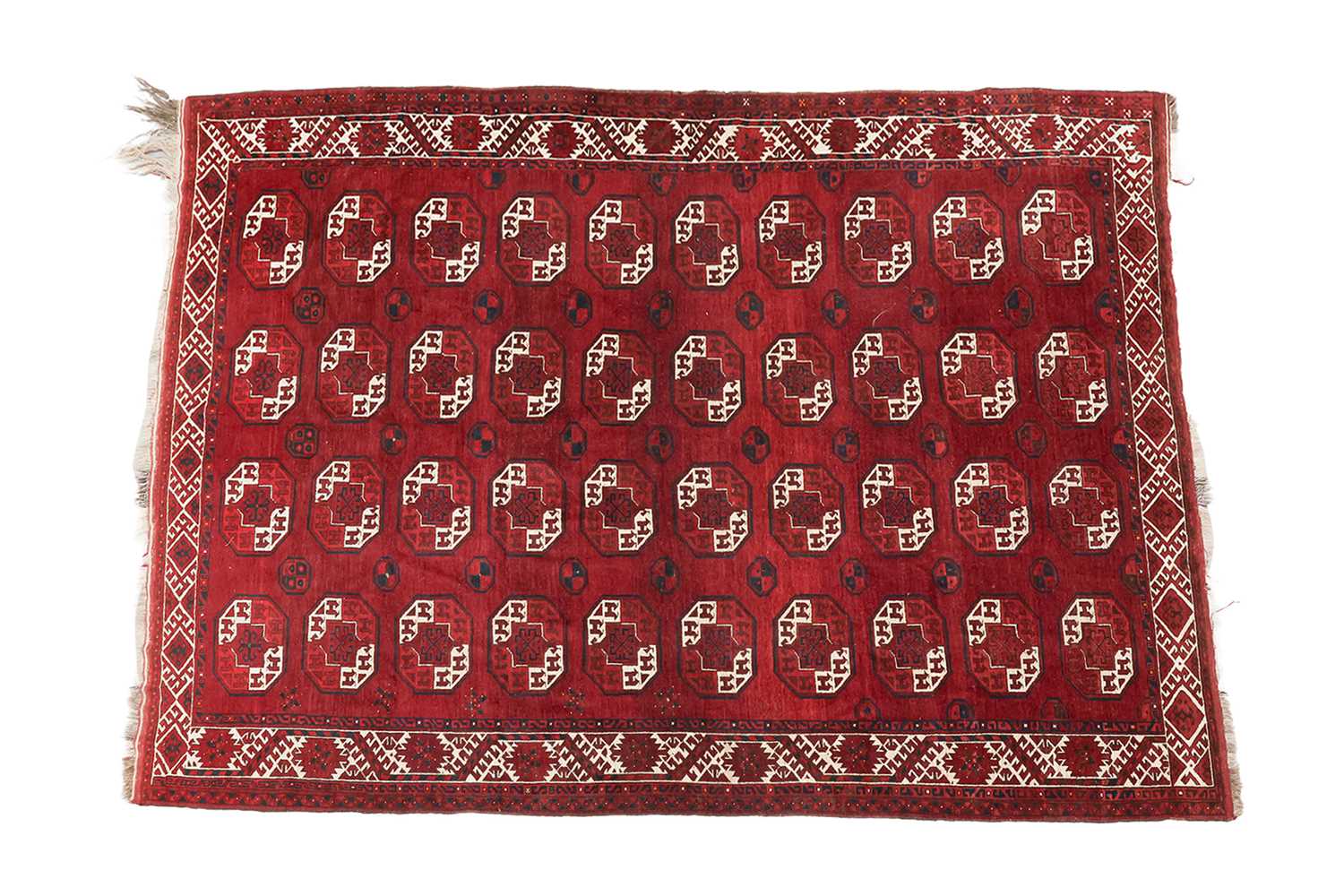 Lot 69 - An Ersari main carpet with four rows of ten...