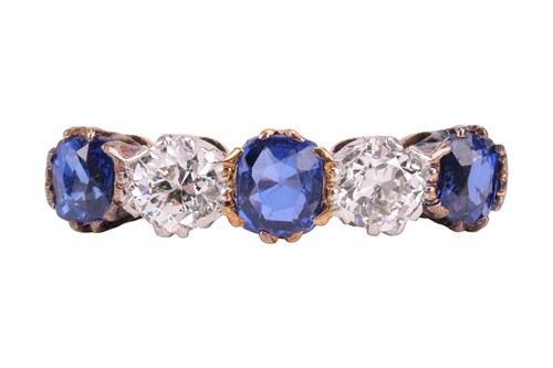 Lot 45 - A diamond and sapphire half-eternity ring,...