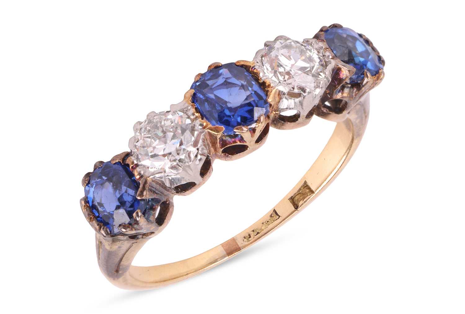 Lot 45 - A diamond and sapphire half-eternity ring,...