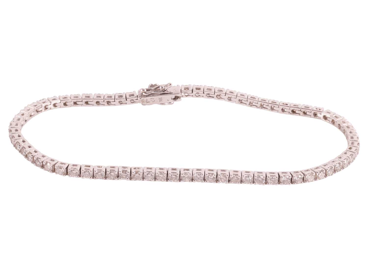 Lot 171 - A diamond-set line bracelet, comprising...