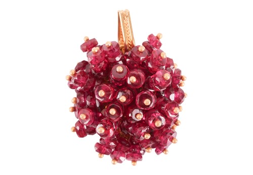 Lot 101 - A ruby cluster pendant, set throughout with...