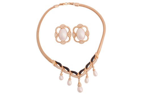 Lot 138 - Christian Dior - A paste and black enamel...