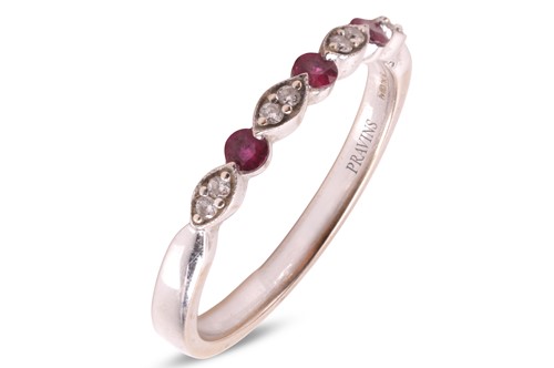 Lot 31 - A ruby and diamond half eternity ring, the...