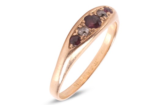 Lot 45 - A ruby & diamond-set ring, featuring three...