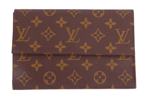 Lot 150 - Louis Vuitton - a trifold wallet in brown...