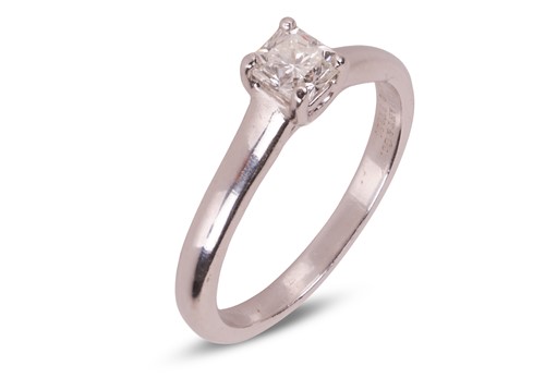 Lot 208 - Tiffany & Co. - A diamond solitaire ring, the...