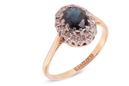 Lot 141 - A sapphire and diamond cluster ring, the...