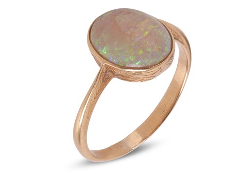 Lot An opal dress ring, comprising an oval...