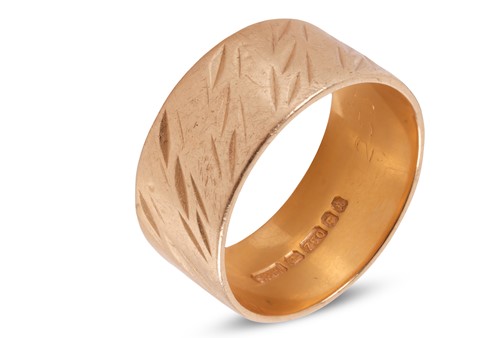Lot 77 - An 18ct gold band ring, 8.8mm in width, with...