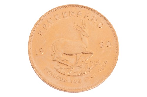 Lot 179 - A South African 1oz Krugerrand, dated 1980, 34....