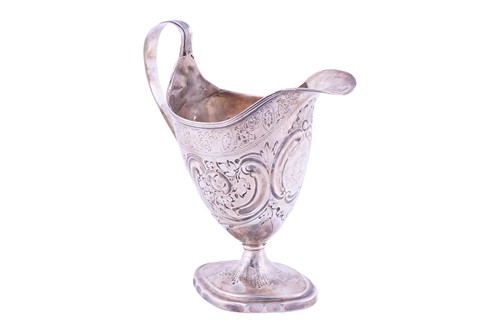Lot 235 - A George III silver helmet cream jug, by...