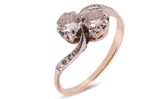 Lot 49 - A diamond Toi et Moi ring, with two round...