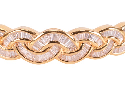 Lot 148 - A diamond set bangle, designed as a series of...