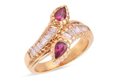 Lot 102 - A ruby & diamond-set dress ring, of bypass...