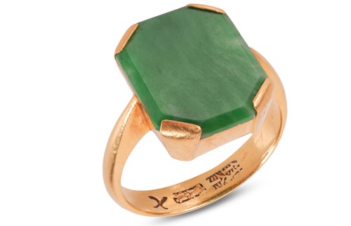 Lot 82 - A jade-set panel ring, the emerald-cut jade...