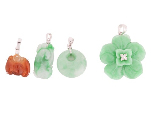 Lot 66 - Four Chinese carved jade pendants; the first...