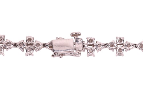 Lot A diamond-set necklace of abstract foliate...